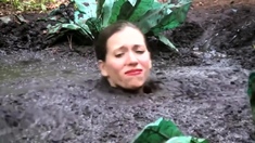 Busty Samantha gets very dirty outdoors in pool of mud