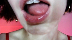 Ebony brunette masturbates with dildo in close up