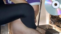 A Mature Woman In Black Leggings Performs An Intense Ha